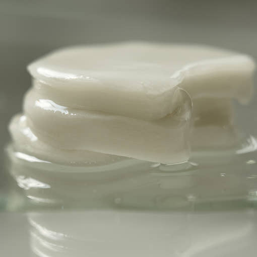 ProtoClinical k-beauty muted olive beauty product packaging on a soft green background.