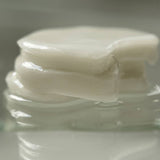 ProtoClinical k-beauty muted olive beauty product packaging on a soft green background.