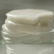 ProtoClinical k-beauty muted olive beauty product packaging on a soft green background.
