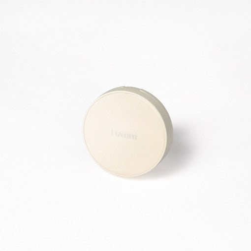 ProtoClinical k-beauty soft beige beauty product packaging on a light background.