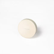 ProtoClinical k-beauty soft beige beauty product packaging on a light background.