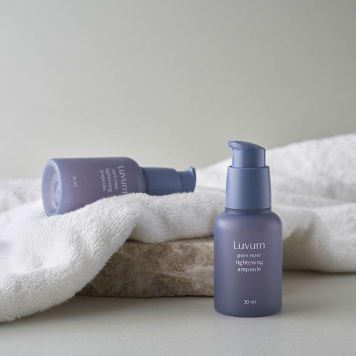 ProtoClinical k-beauty product packaging on a light background.