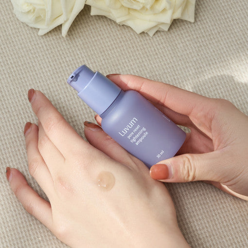 ProtoClinical k-beauty cosmetic packaging in soft pink and beige tones on a light background.
