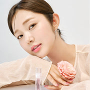 ProtoClinical k-beauty Luvum Volume Lip Serum 4ml peach-toned package on a pale aqua and beige background.