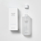 ProtoClinical k-beauty Luvum Witch Hazel Hyaluronic Low pH Toner 300ml light beige vertical package silhouette with dark side framing on a pale background