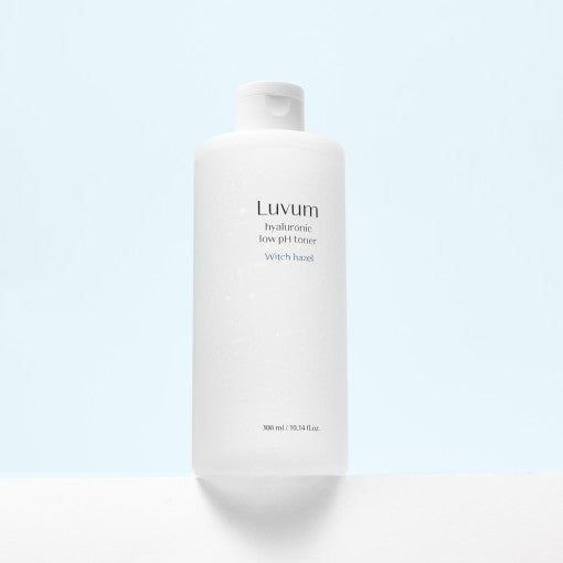 ProtoClinical k-beauty Luvum Witch Hazel Hyaluronic Low pH Toner 300ml light beige vertical package silhouette with dark side framing on a pale background.