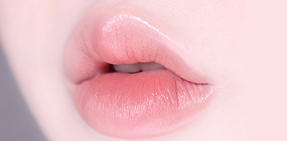 ProtoClinical k-beauty TONYMOLY Easy Touch Auto Lip Liner rosy pink oval lip liner swatch with gray side shading on a pale background
