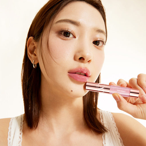 ProtoClinical k-beauty TONYMOLY Get it Tint Plumper bright rose diamond lip tint swatch with pale green corners on a soft background