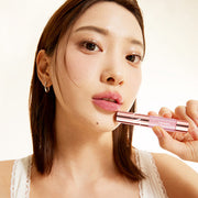 ProtoClinical k-beauty TONYMOLY Get it Tint Plumper bright rose diamond lip tint swatch with pale green corners on a soft background