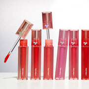 ProtoClinical k-beauty TONYMOLY PERFECT LIPS SHOCKING LIP (14 Colors) 4g single upright coral-red lip tint tube centered on a pale cream background