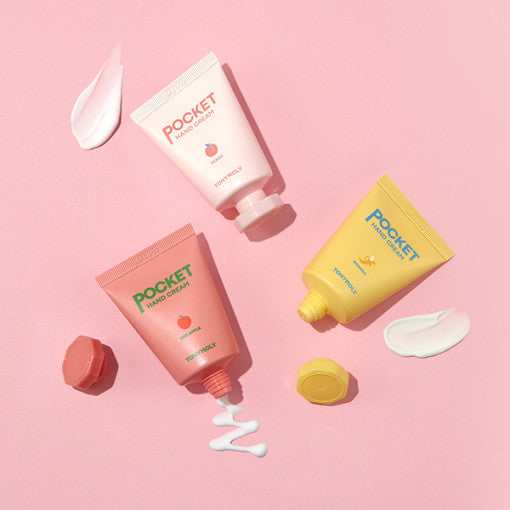 ProtoClinical k-beauty TONYMOLY Pocket Hand Cream 30ml (3-type) single peach hand cream tube lying horizontally on a pink background