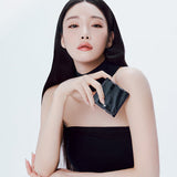 ProtoClinical k-beauty charcoal beauty product silhouette with pale side highlights on a white background.