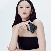 ProtoClinical k-beauty charcoal beauty product silhouette with pale side highlights on a white background.