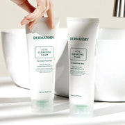 ProtoClinical k-beauty DERMATORY Pro Trouble Acne Cleansing Foam 150ml single upright gray cleansing foam tube centered on a soft white background with warm beige upper shading.