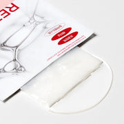 ProtoClinical k-beauty DERMATORY Retinal Derm Band Mask 28g X 10ea close-up of an opened white-and-peach sachet with a folded white mask on a clear round dish