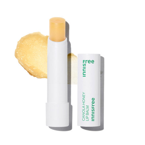 ProtoClinical k-beauty innisfree Canola Honey Lip Balm single upright pale yellow lip balm tube centered on a soft cream background