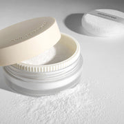 ProtoClinical k-beauty innisfree Pore Blur Powder 11g single compact powder case in pale beige tones on a muted gray and lavender background