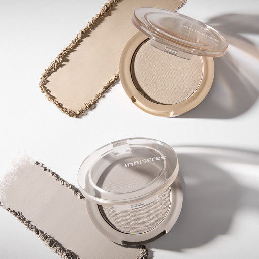 ProtoClinical k-beauty innisfree Sculpting Powder Shading shown as two open round powder compacts with clear lids beside textured beige swatches on a bright white background