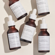 ProtoClinical k-beauty taupe beauty graphic with soft vertical bands on a light background.