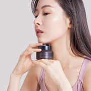 ProtoClinical k-beauty [MARY & MAY] Idebenone + Blackberry Complex Intense Cream 70g in a soft peach and mauve graphic with a dark vertical center band and muted olive corners