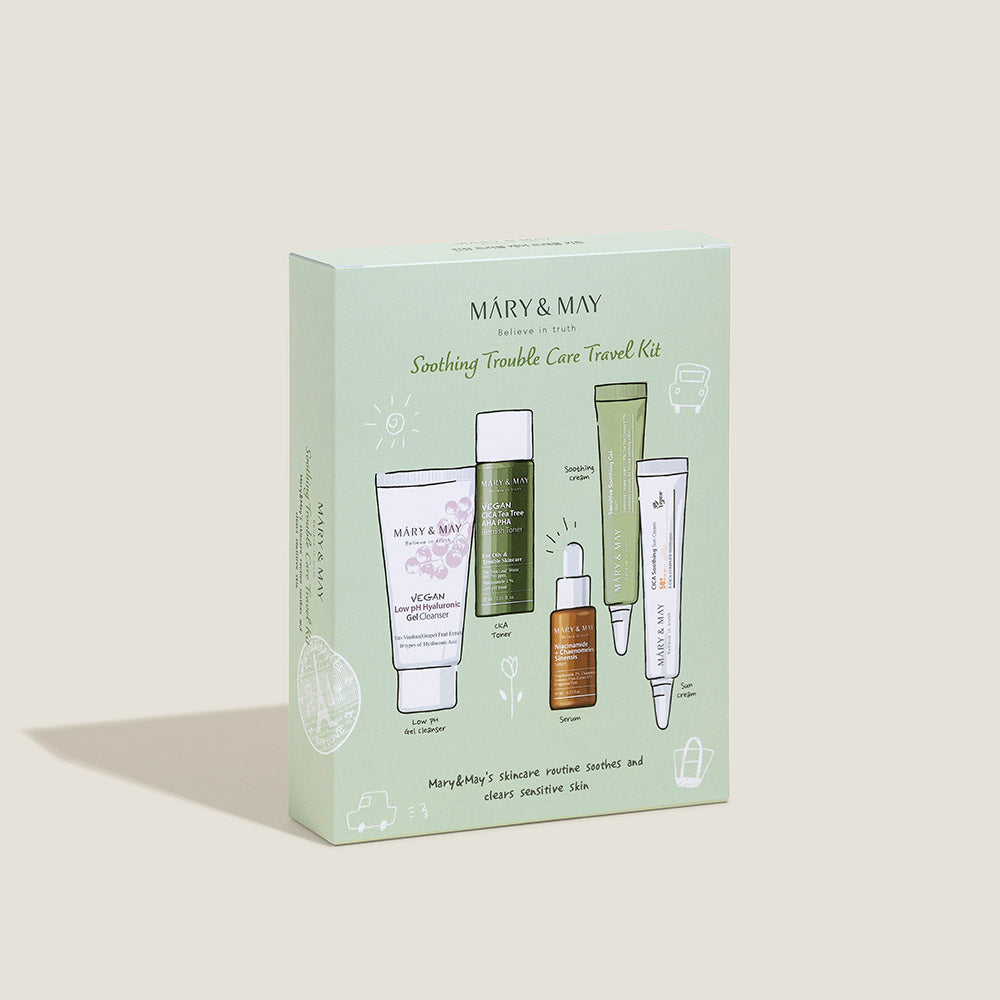 [MARY & MAY] Soothing Trouble Care Travel Kit (5pcs) by ProtoClinical shown as green travel kit packaging on a soft pink and beige background for a k-beauty skincare routine.