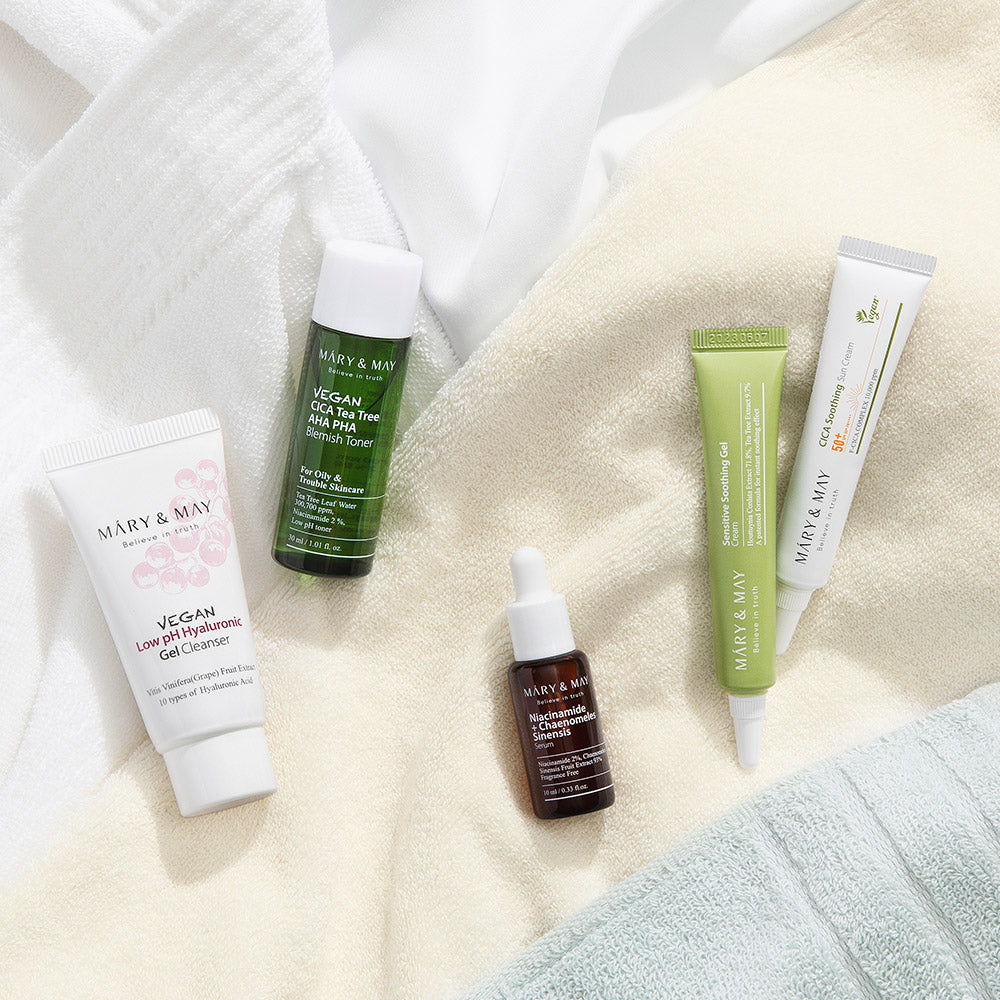 [MARY & MAY] Soothing Trouble Care Travel Kit (5pcs) by ProtoClinical displayed with multiple travel kit products on a light neutral background for a k-beauty skincare routine.