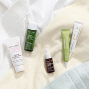 [MARY & MAY] Soothing Trouble Care Travel Kit (5pcs) by ProtoClinical displayed with multiple travel kit products on a light neutral background for a k-beauty skincare routine.