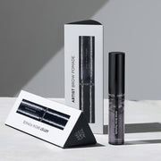 ProtoClinical k-beauty JUNGSAEMMOOL Artist Brow Pomade 7.5g soft gray beauty graphic with charcoal blocks and pale cream accents on a light background.
