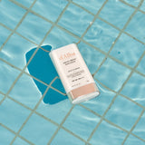 ProtoClinical k-beauty aqua beauty product silhouette with a pale center on a cool blue background.