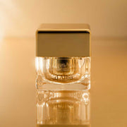 ProtoClinical k-beauty warm tan beauty graphic with a soft blush band and darker vertical center.