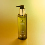 ProtoClinical k-beauty green-gray beauty product silhouette with a dark lower-right shape on a light background.