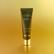 ProtoClinical k-beauty golden beauty product silhouette with a dark olive vertical center on a warm yellow background.