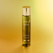 ProtoClinical k-beauty warm golden beauty product silhouette with a dark vertical center on a pale yellow background.