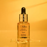ProtoClinical k-beauty warm orange beauty product silhouette with a darker vertical center on a bright amber background.