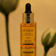 ProtoClinical k-beauty olive and golden beauty product silhouette with a warm brown center on a light background.