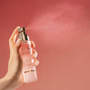 ProtoClinical k-beauty muted rose beauty graphic with a soft peach lower band on a warm pink background.