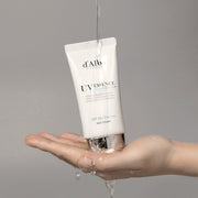 ProtoClinical k-beauty taupe beauty product silhouette with a bright vertical center on a muted gray background.