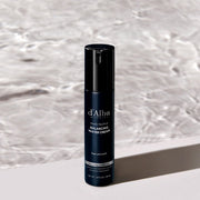 ProtoClinical k-beauty dark bottle silhouette centered between pale vertical side panels on a white background.