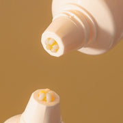 ProtoClinical k-beauty warm brown beauty product packaging with soft cream highlights on a light background.