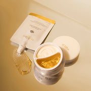 ProtoClinical k-beauty warm gold beauty product packaging with a pale center on a light background.