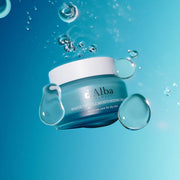 ProtoClinical k-beauty deep blue beauty product packaging with aqua lower accents on a light background.