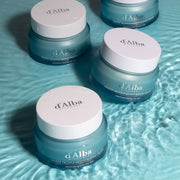 ProtoClinical k-beauty cool gray beauty product packaging with a dark center and aqua accents on a light background.