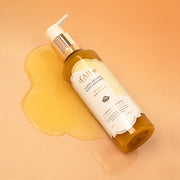 ProtoClinical k-beauty warm amber beauty product packaging with deeper brown accents on a light background.