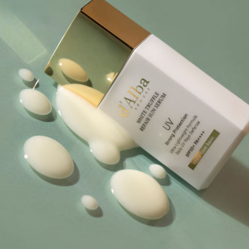 ProtoClinical k-beauty beige beauty product packaging with soft rose and cream tones on a muted light background.
