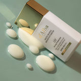ProtoClinical k-beauty beige beauty product packaging with soft rose and cream tones on a muted light background.