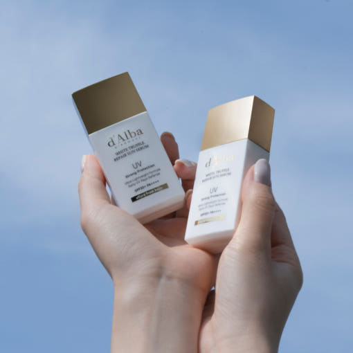 ProtoClinical k-beauty pale blue and taupe beauty product packaging on a cool light background.