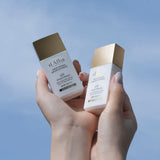 ProtoClinical k-beauty pale blue and taupe beauty product packaging on a cool light background.