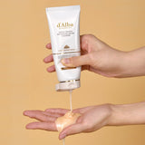 ProtoClinical k-beauty soft beige beauty product packaging with warm tan tones on a light background.