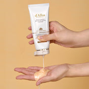 ProtoClinical k-beauty soft beige beauty product packaging with warm tan tones on a light background.