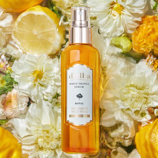 ProtoClinical k-beauty d'Alba White Truffle Royal Intensive Serum 100ml single upright amber serum bottle centered on a light background with soft aqua and peach side shading